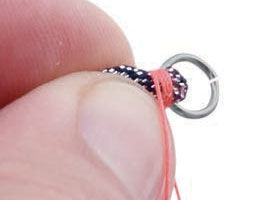 Wrapping thread around material under jump ring